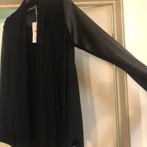 Zara Jackets & Coats - NEVER WORN black sweater with faux leather sleeves Zara Jackets & Coats - NEVER WORN black sweater with faux leather sleeves